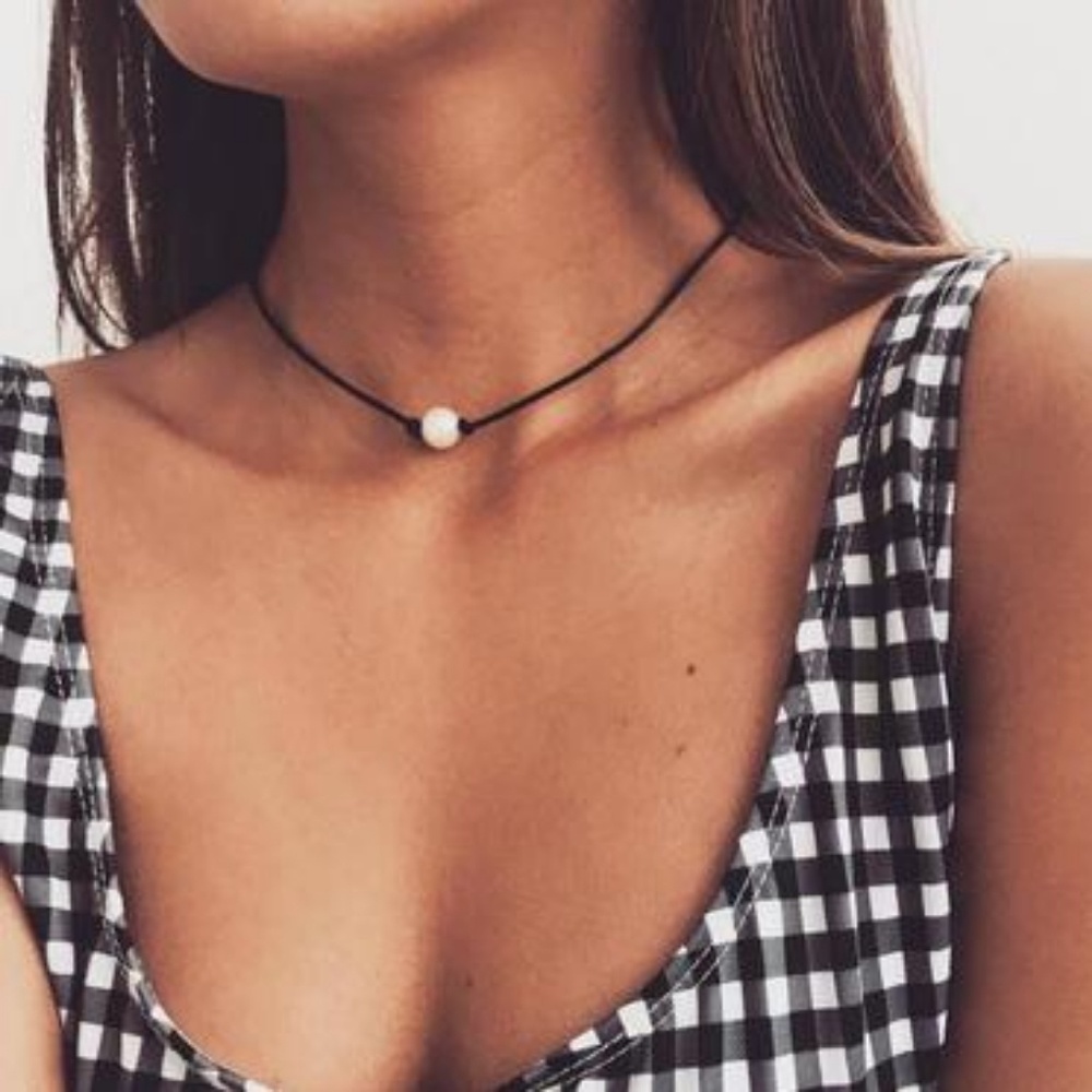 Pearl on black rope necklace